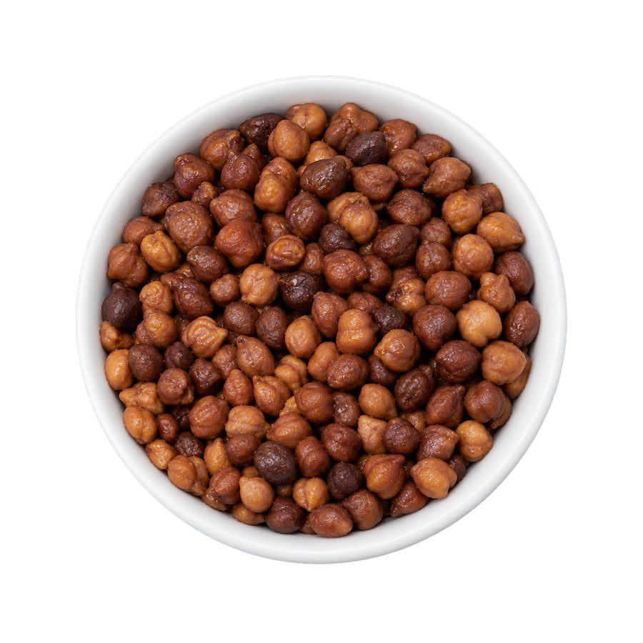 Overhead view of cooked Kala Chana black chickpeas in a white ceramic bowl