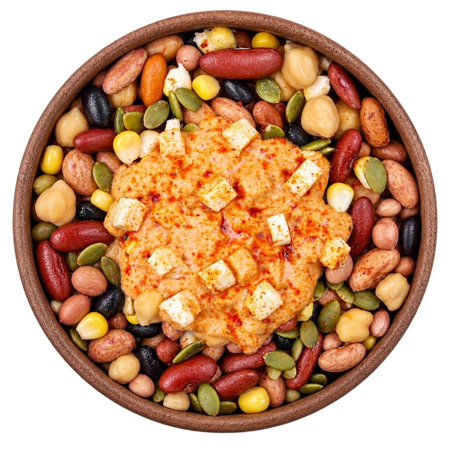 Spicy Peri Peri Beans in a brown bowl with mixed beans, chickpeas, corn, groundnuts, pumpkin seeds, paneer and peri peri yogurt